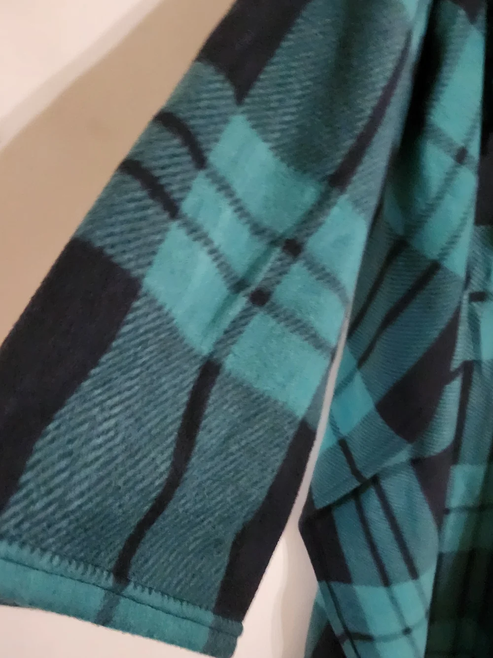 Plaid Throw Blanket in Green and Black, Sleeves & Pockets.  Approx 72x52 In.